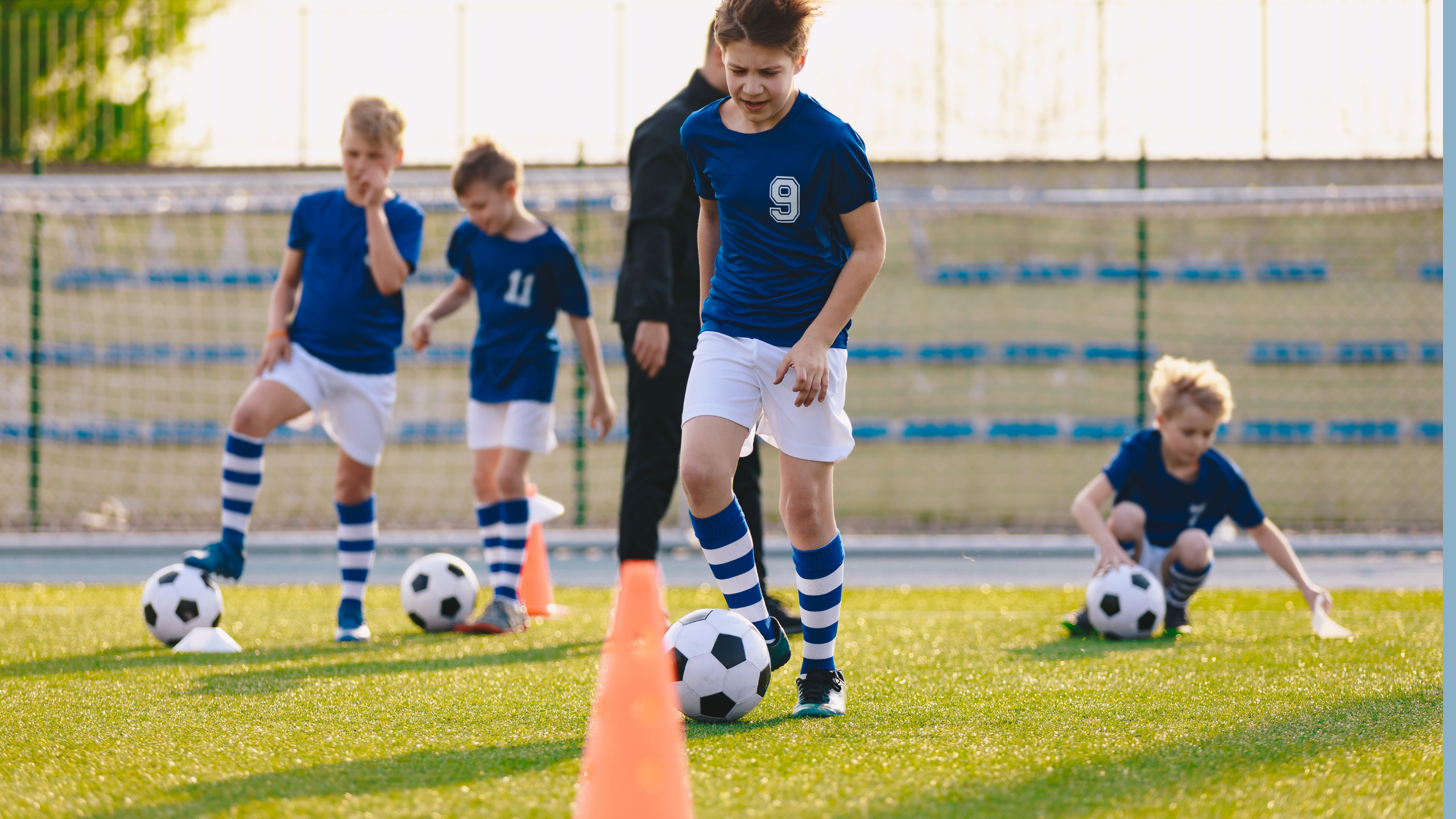 Kids at soccer practice with cones